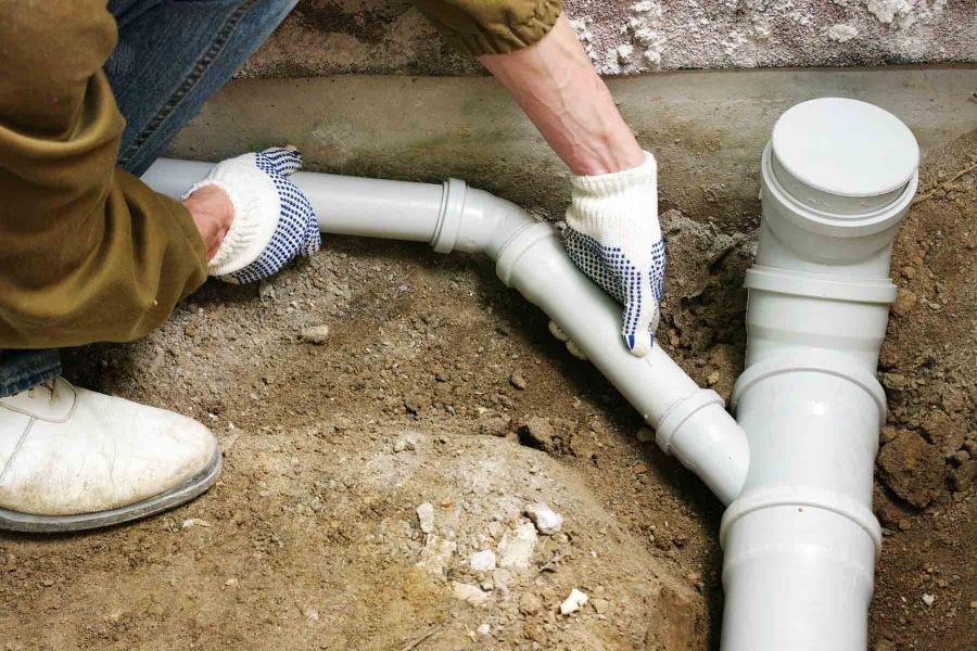 homeguide PVC sewer pipe and cleanout at residential